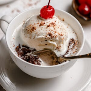 baked mug cake with ice cream and cherry
