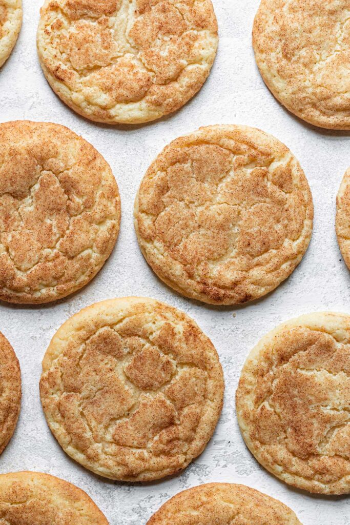snickerdoodle cookies laying flat on board