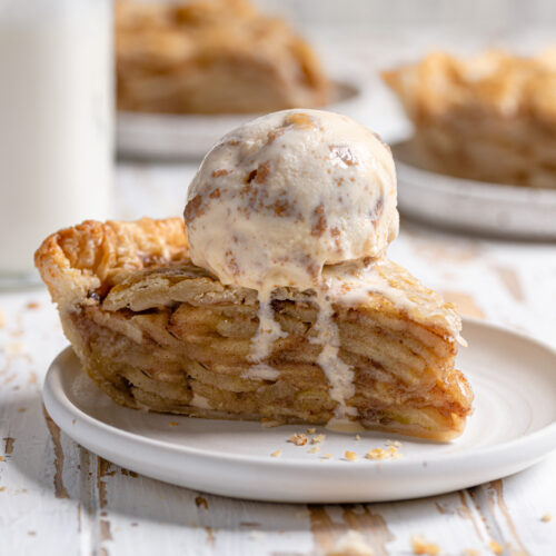 slice of apple pie with melting ice cream on top