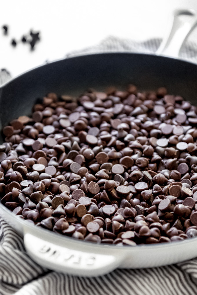 Chocolate chips in a cast iron skillet.