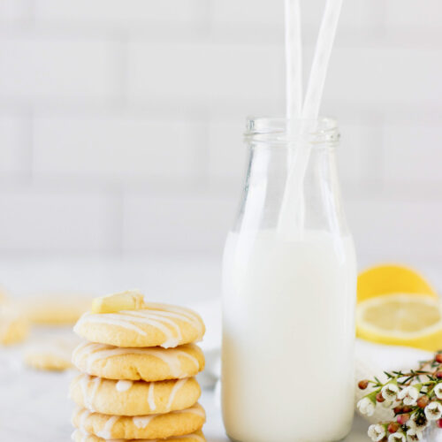 stack of lemon cookies with milk