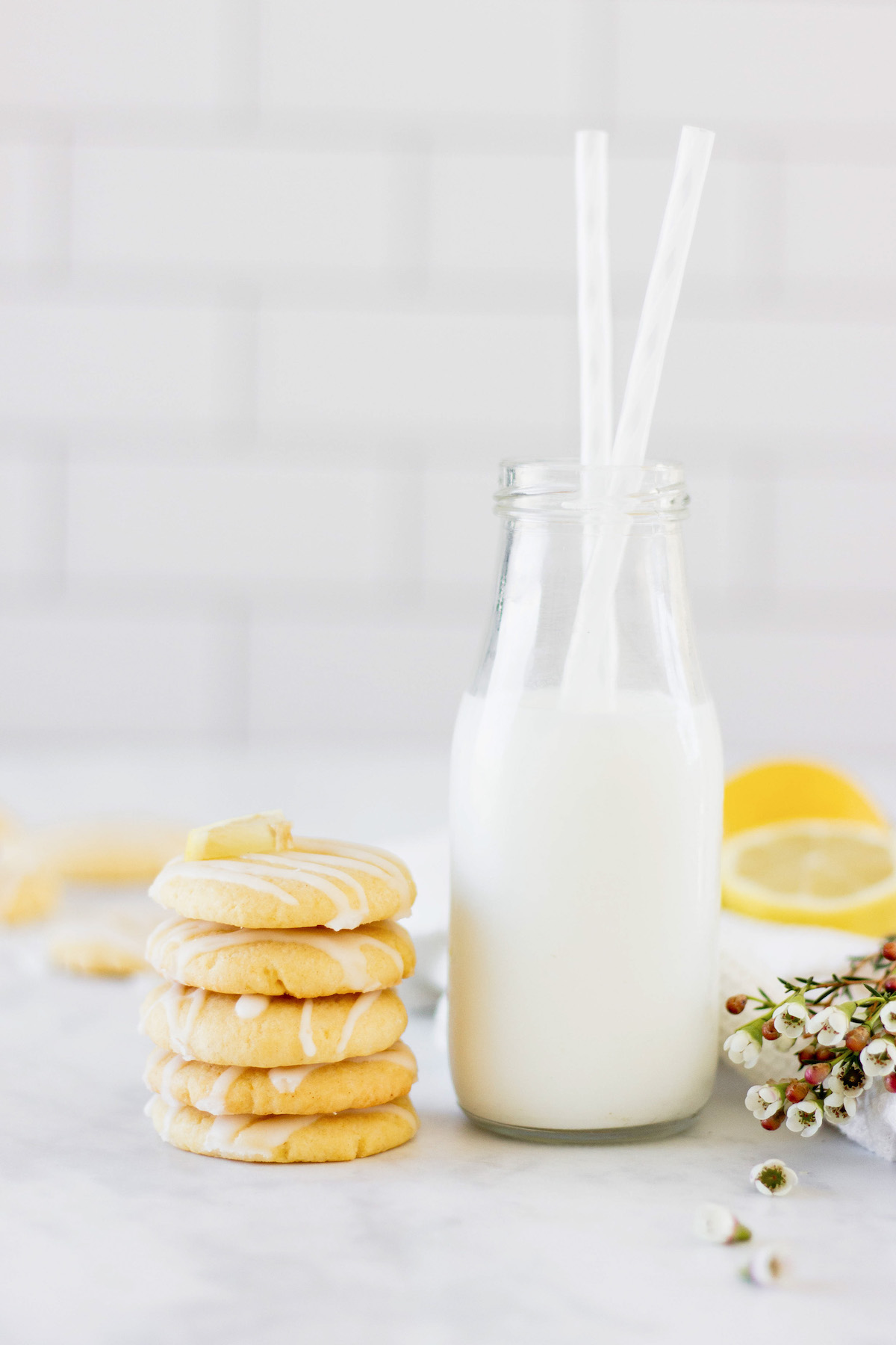 stack of lemon cookies with milk