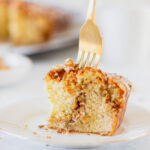 fork in piece of cinnamon streusel coffee cake