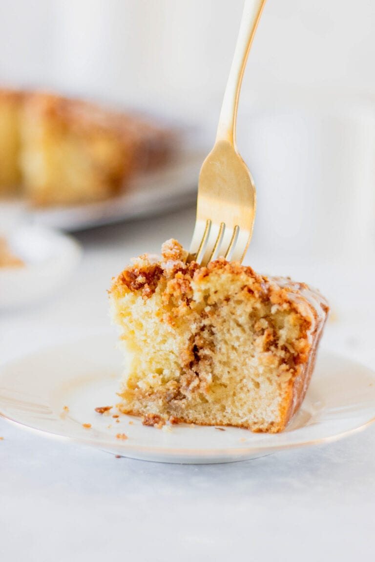 fork in piece of cinnamon streusel coffee cake
