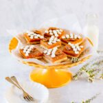 cake stand with pieces of pumpkin dessert lasagna