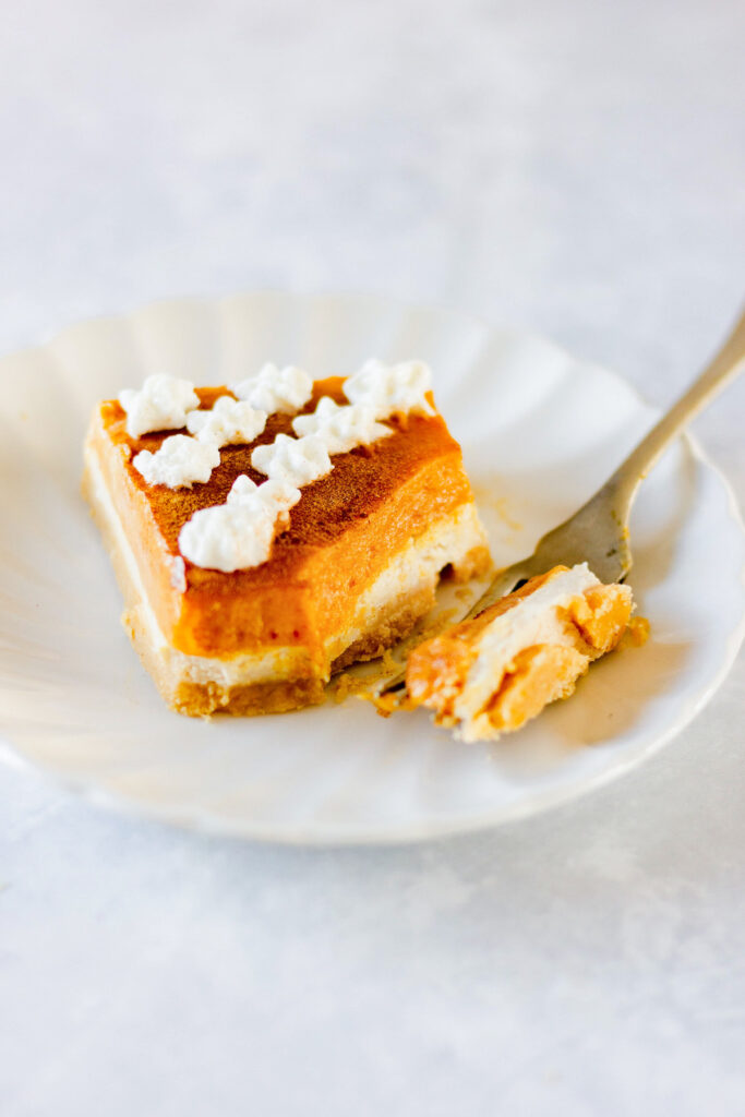 pumpkin cheesecake bar with bite taken out