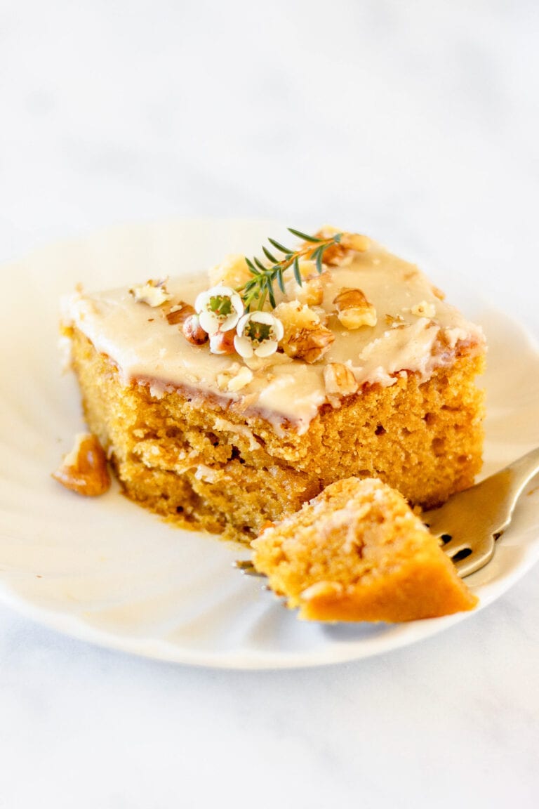 bite taken out of pumpkin bar on white plate