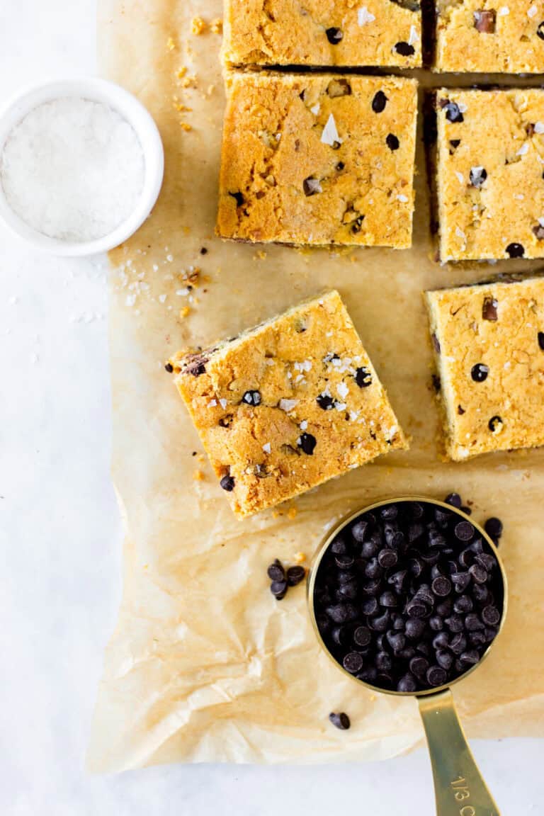 chocolate chip cookie bars on brown parchment paper