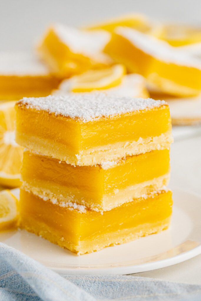 lemon bars stacked on top of one another