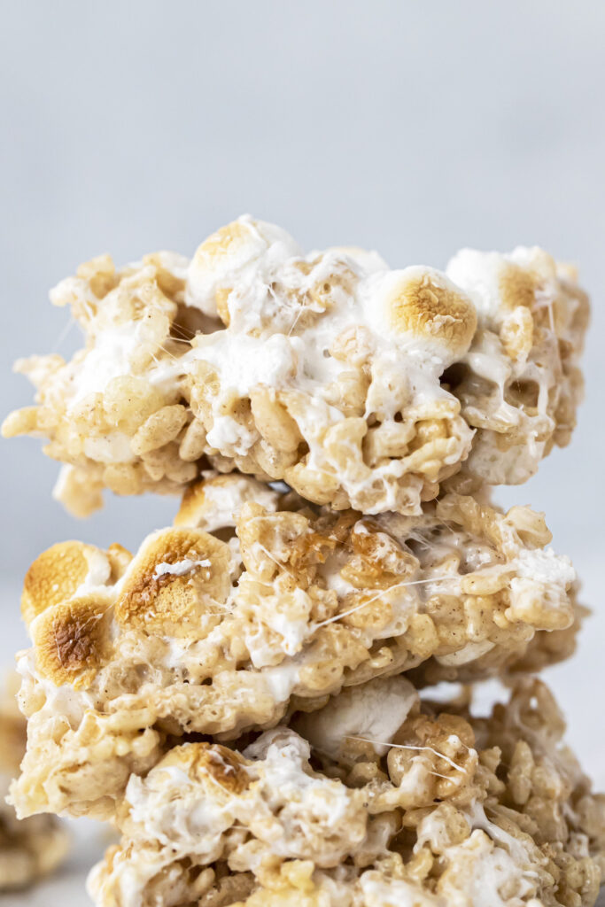 close up of brown butter rice krispie treats stacked on top of each other