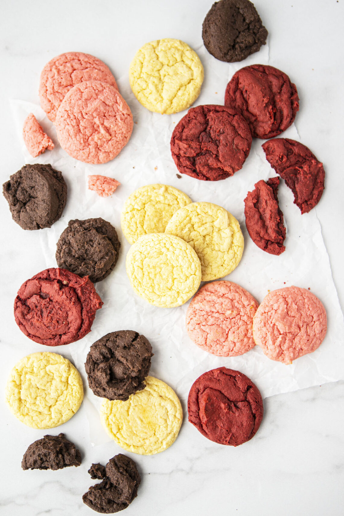 four different cake mix cookies on a counter