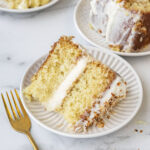 slices of coconut cake on plates