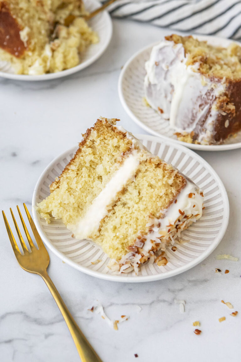 slices of coconut cake on plates
