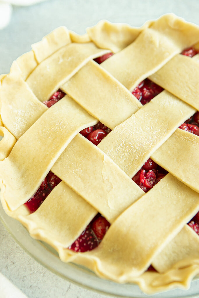 lattice of pie dough over pie