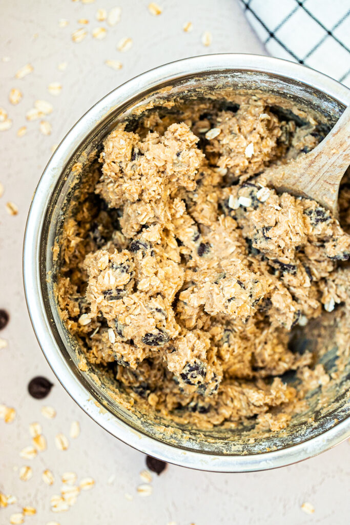 oatmeal chocolate chip cookie dough in a metal bowl