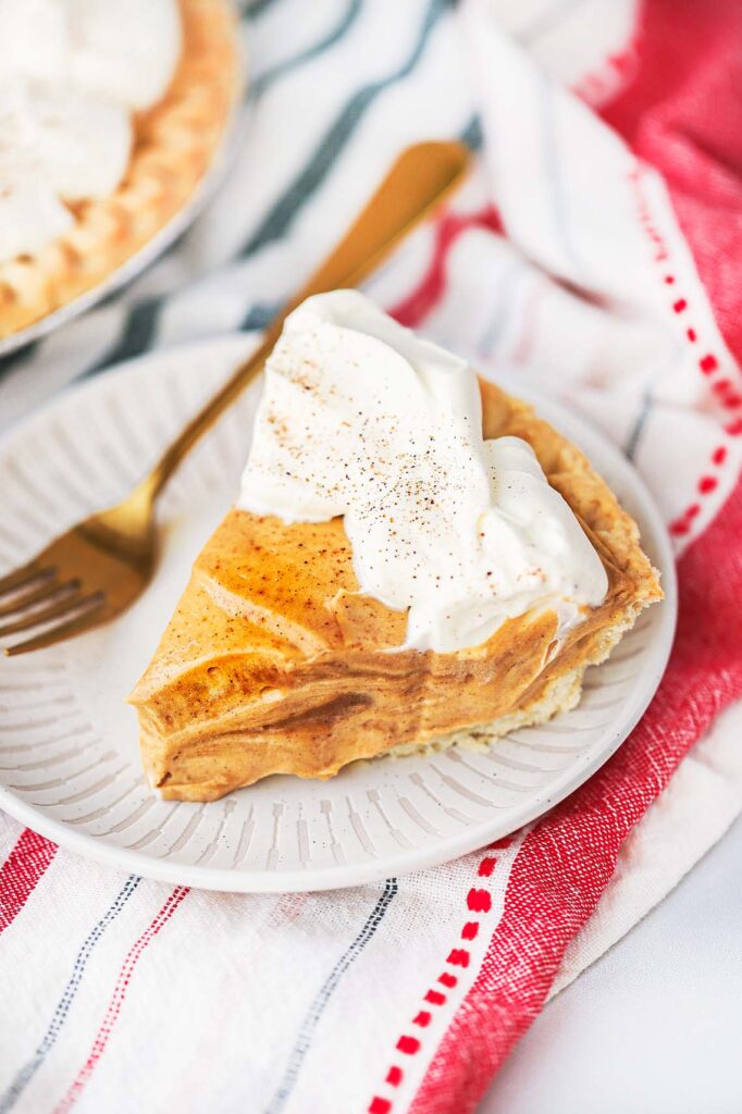 Slice of Gingerbread cream pie with whipped cream