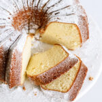 vanilla bundt cake with slices taken out of it