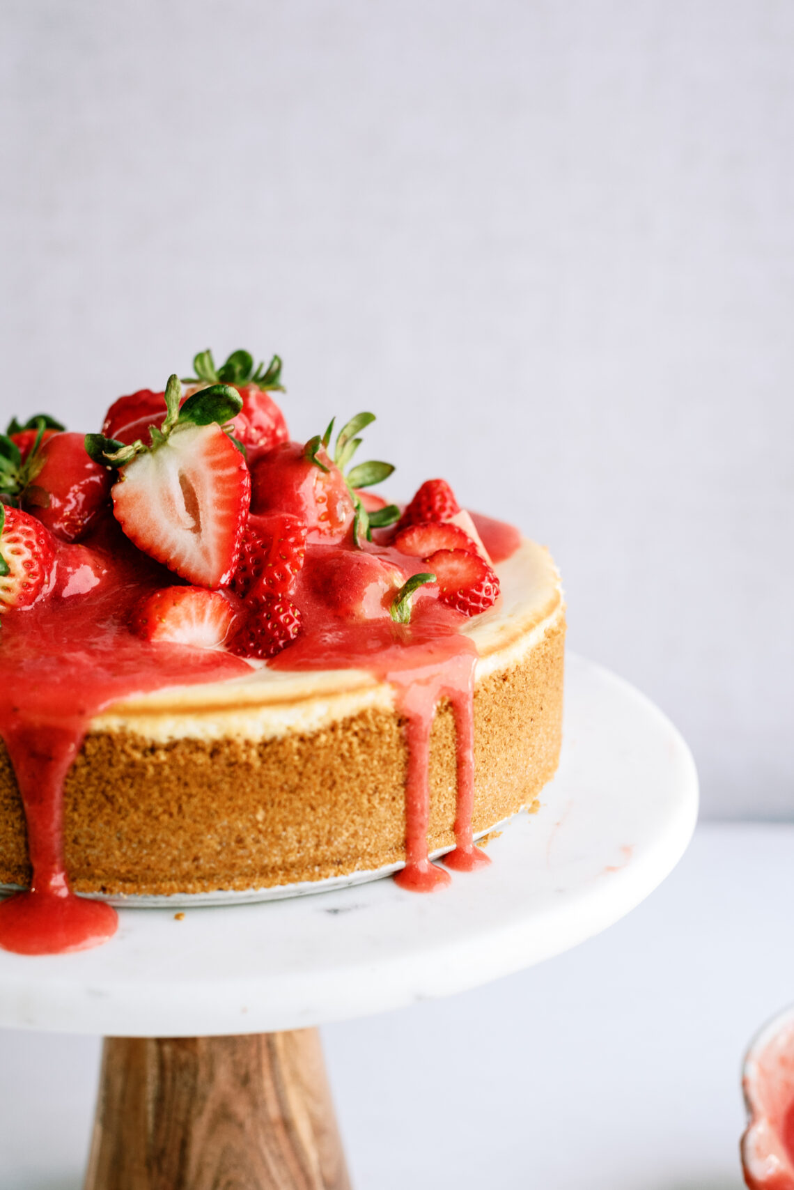 strawberry cheesecake on a cake stand