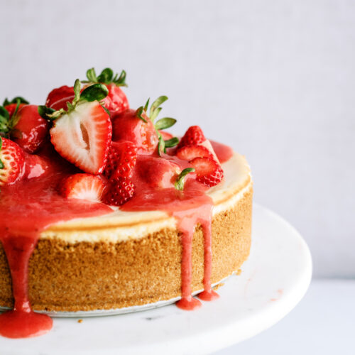 strawberry cheesecake on a cake stand