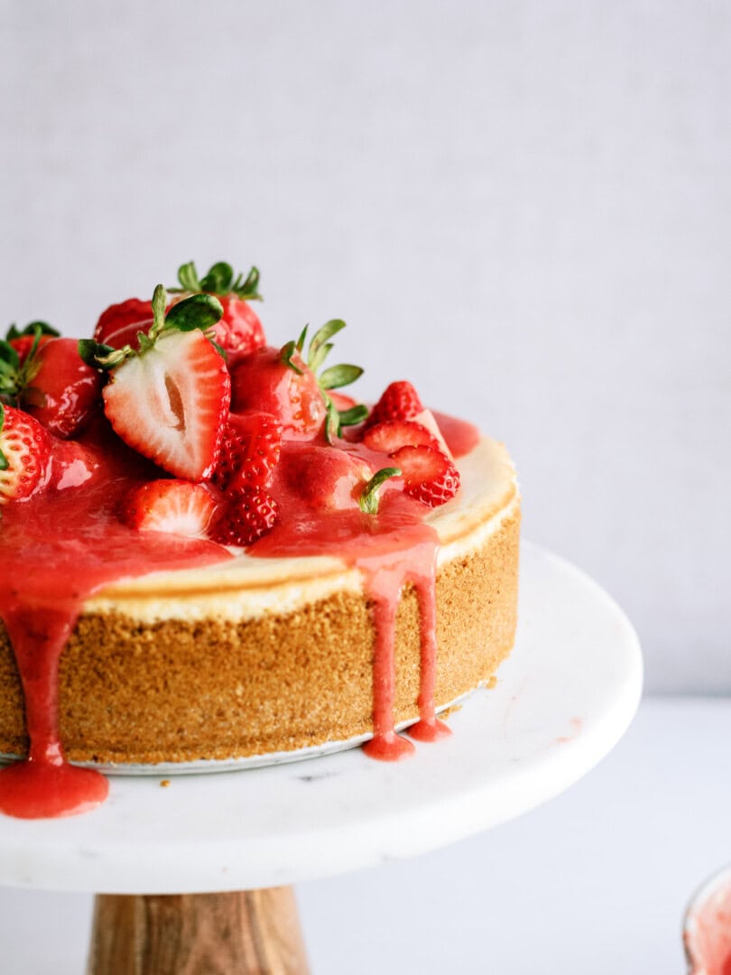 strawberry cheesecake on a cake stand