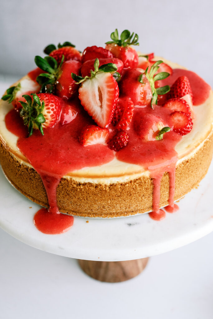 strawberry cheesecake on a cake stand