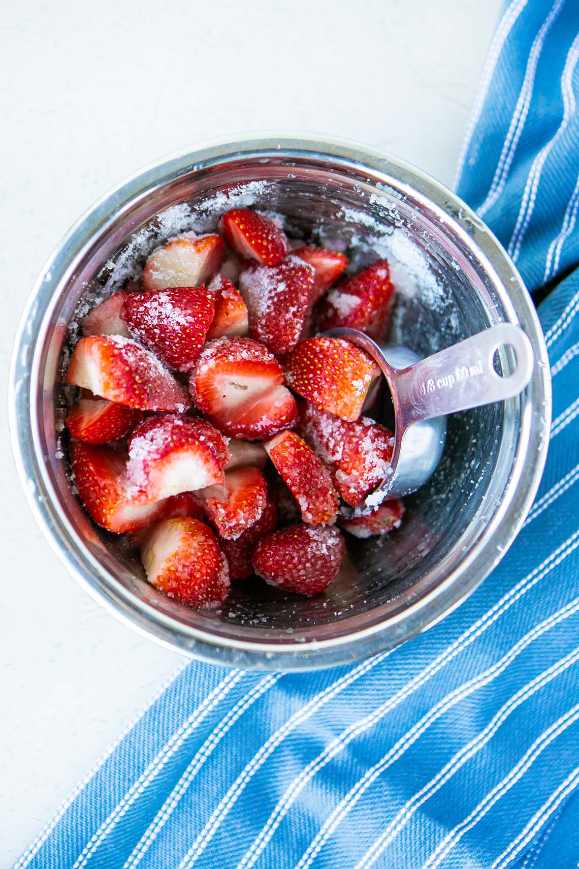 fresh strawberries with sugar in bowl