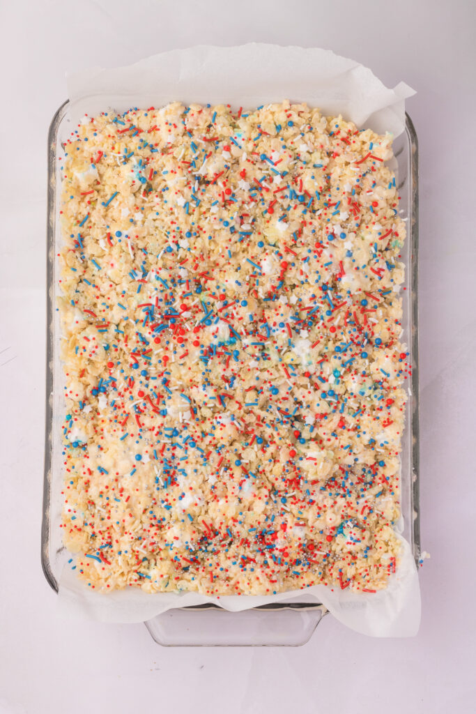 A square baking dish filled with 4th of july rice krispies treats
