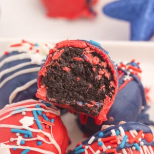 Red, white and blue chocolate balls with white icing.