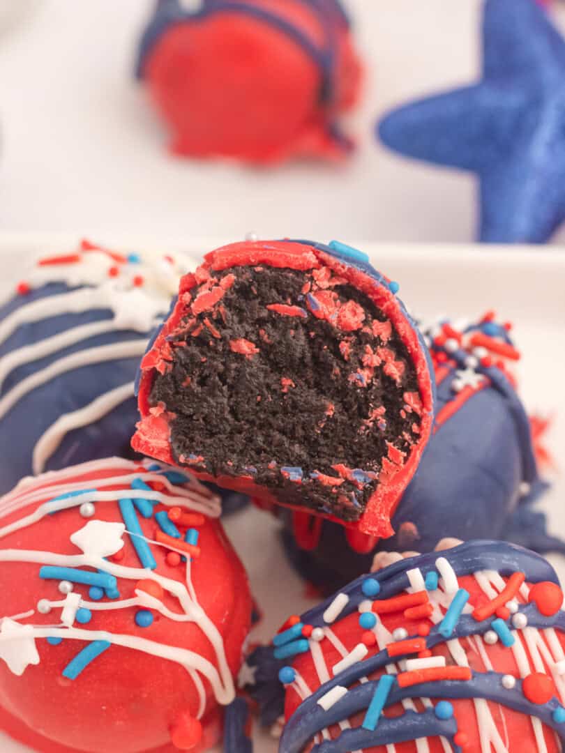 Red, white and blue chocolate balls with white icing.