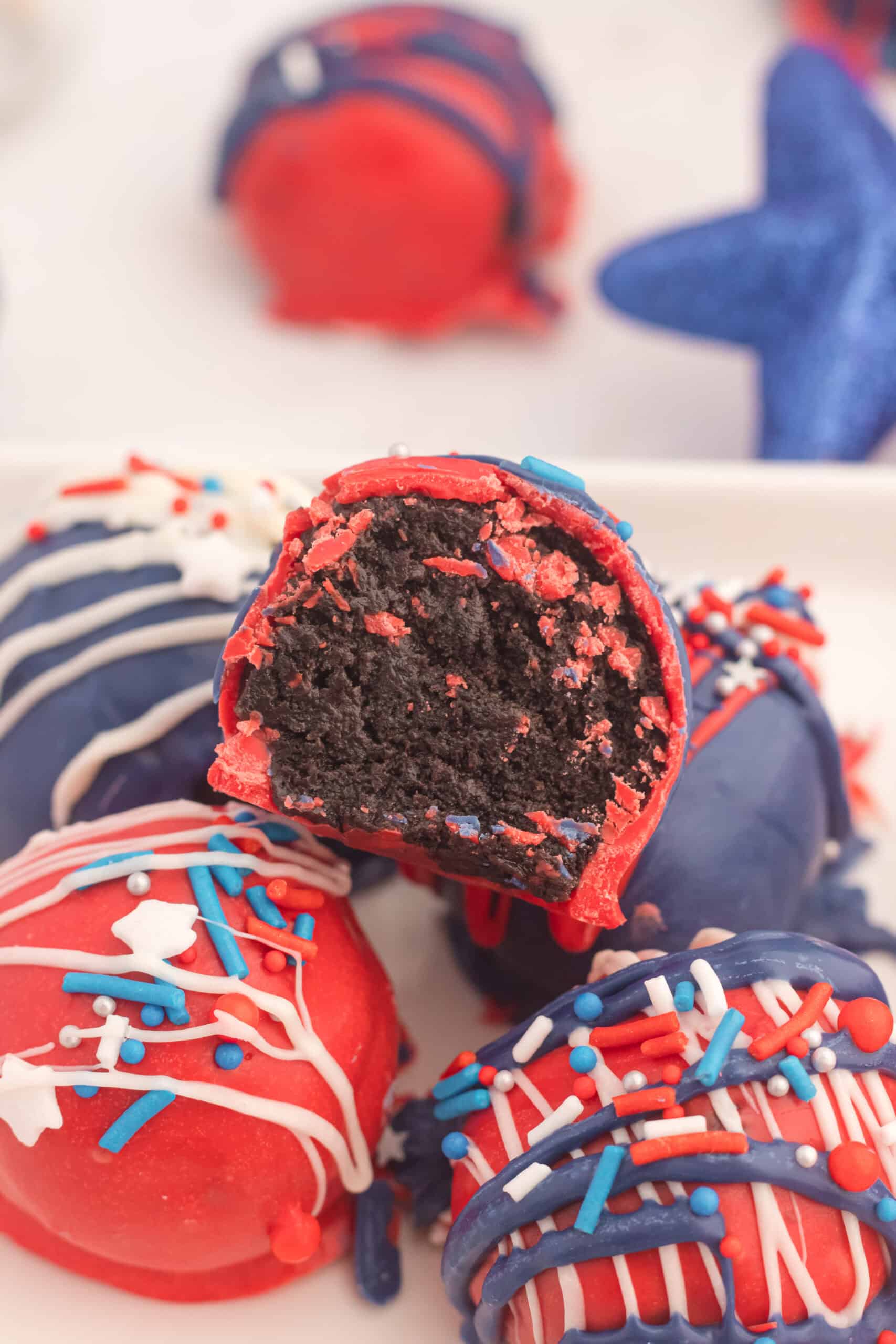 Red, white and blue chocolate balls with white icing.